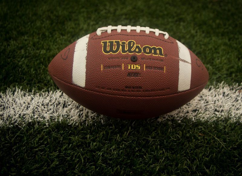 Wilson football on grassy field with white line on field near The Inn at Ohio Northern University in Ada, OH